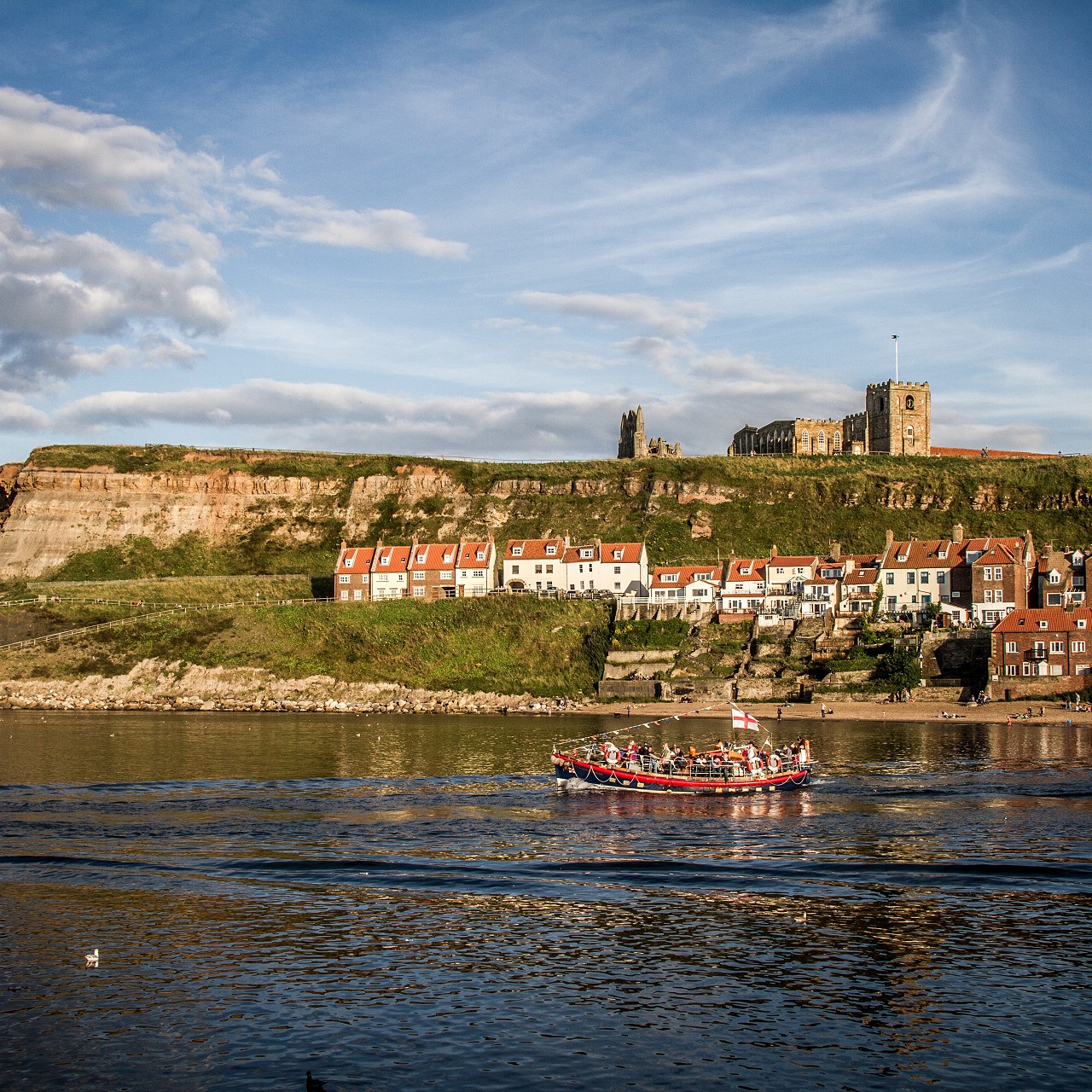Whitby harbour with the abbey and St Mary's church in the background